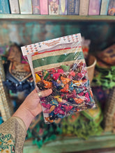 Load image into Gallery viewer, Colourful hanging decorative item with beads and small figures on a grey background www.karmaripon.co.uk