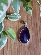 Load image into Gallery viewer,  a purple teardrop-shaped amethyst pendant www.karmaripon.co.uk