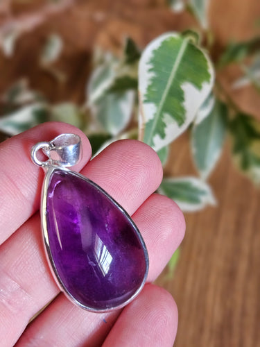  a purple teardrop-shaped amethyst pendant www.karmaripon.co.uk