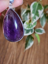 Load image into Gallery viewer,  a purple teardrop-shaped amethyst pendant www.karmaripon.co.uk